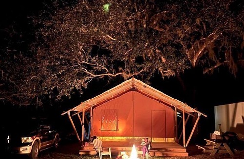 Highland RV Rental | Charming Safari Tent for Group Glamping in Nature in Basinger, Florida