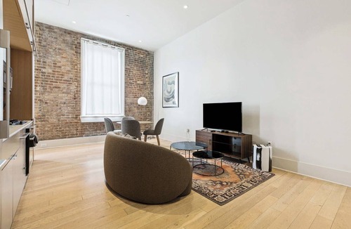 Tulane - Gravier Apartment | Chic 1BR in Historic School House | Gated Parking Included