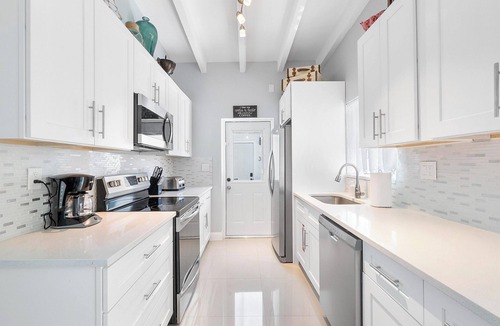Dolphin Isles Apartment | Chic Modern Oasis with Pool – Steps from the Shore