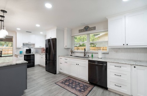 Tarpon Springs House | Coastal Luxury - Walk to Beach - Heated Pool