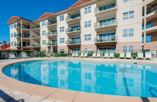 Frangista Beach Condo | Comfortable ground floor condo with pool & hot tub access, W&D, WiFi, and AC