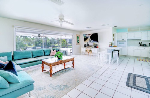 Yacht Club House | Cozy 1960s home with heated pool, city & canal located