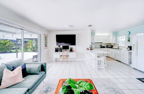 Yacht Club House | Cozy 1960s home with heated pool, city & canal located