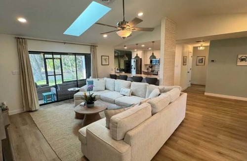 Gulf Cove House | Cozy and private waterfront retreat with hot tub, grill, deck, and firepit!