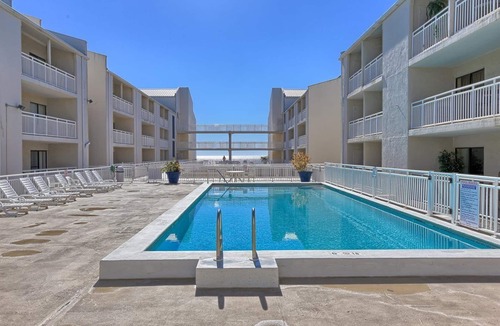 Orange Beach Condo | Cozy Beach Condo with Private Beach, heated pool, High Speed WiFi, and More.