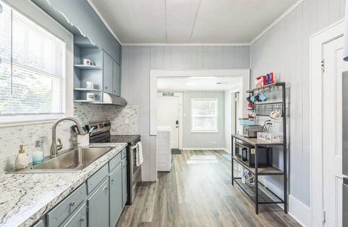 South Pensacola House | Cozy Bungalow near Downtown Pensacola: Game Room, Patio + Fire Pit, 3 Bedroom!