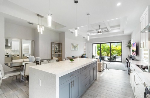 Naples Park House | Designer Home, Heated Pool, Close to Beaches ,Game Room with Pinball, FREE BIKES