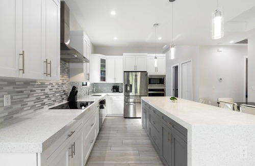 Naples Park House | Designer Home, Heated Pool, Close to Beaches ,Game Room with Pinball, FREE BIKES