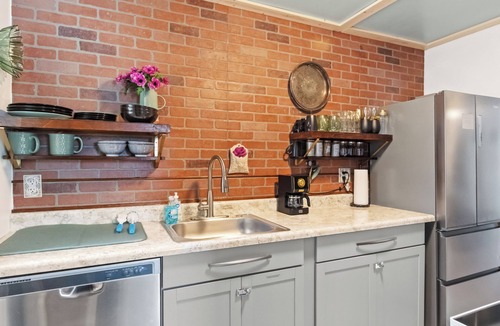 Warrington House | Discover this stunning, cozy retreat. Features a spacious, dedicated home office with curated books and games, a beautifully furnished living room, and stylish, thoughtful details. Perfect for a relaxing and productive stay.