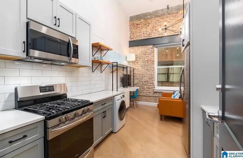 Central City Condo | Downtown Luxe Industrial Loft in Mercantile on Morris! Free parking! Dogs ok.