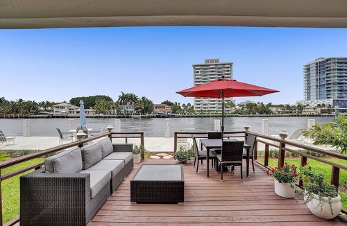 East Fort Lauderdale Condo | Enjoy scenic sunsets on your private deck. Modern condo minutes to the beach.
