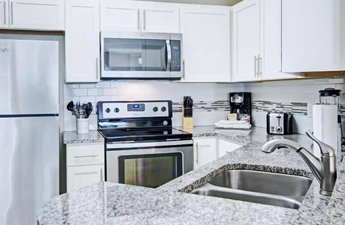 West Kissimmee Hotel | Enjoy Scenic Views from a Stylish Condo in a Relaxing Retreat | Outdoor Pool