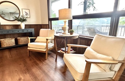 Grant House | Escape to our beautifully updated lakeside retreat, where every detail is designed for comfort and relaxation. From the moment you step inside this 3 bed/2bath house, you'll be captivated by sweeping, unobstructed views of the lake through expansive