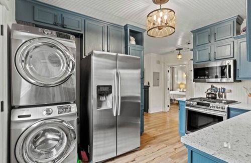 East Pensacola Heights House | Escape to your private castle! This 2BR cottage comfortably fits 4, featuring a private pool, fenced yard, and modern-rustic charm. Perfect for families or couples, it's dog-friendly and just 2 miles from Downtown and 10 miles from Pensacola Beach.