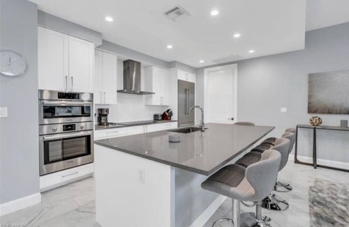 Redevelopment Area Condo | Experience true luxury with this chic and modern condo in Naples.