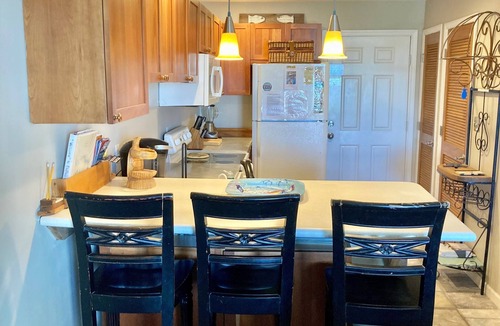 Ono Island Condo | Family Friendly & Quiet Riverside Condo with Pool & Fishing Piers