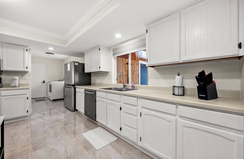 Merritt Island House | Furnished Retreat! Heated Pool, Spa, Game Room, and 4 King Beds!