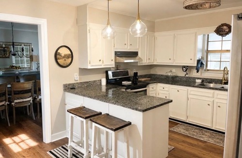 Daphne House | Grand Oak Cottage in Olde Town, 2 King Primary Suites, year round Saltwater Pool