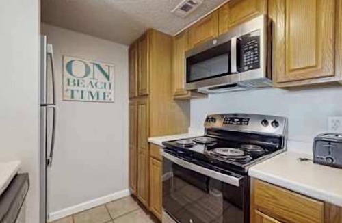 Orange Beach Apartment | Gulf front condo with onsite snack bar, three shared pools, and internet