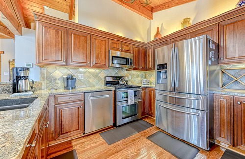 Louisa House | Huge lakefront home with A/C, sunroom, WIFI,game room, deck, & kayaks