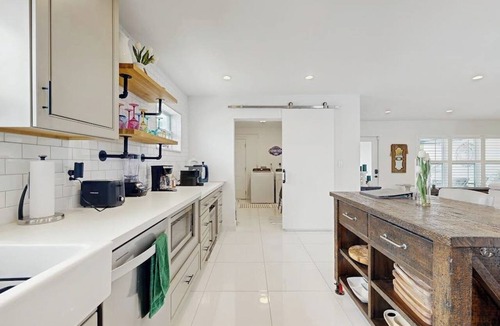 Coral Heights House | Inviting villa with heated saltwater pool & tropical backyard oasis