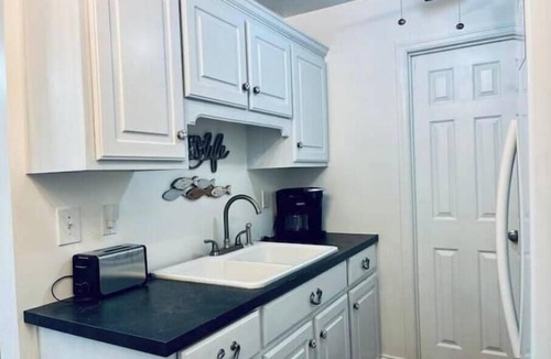 Little Kowaliga House | Lake Martin Boathouse great for couples: steps to the dock. Paddleboat included.