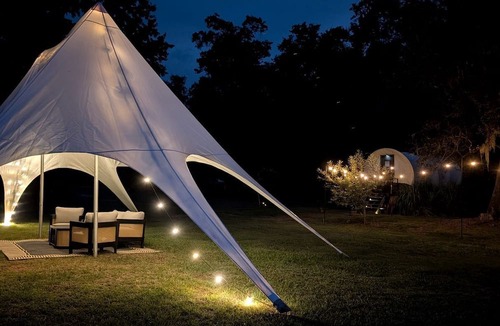Putnam Hall Cabin | Luxury Highland Cow Glamping in Cozy Covered Wagon with Peaceful Farm Retreat in Melrose, Florida