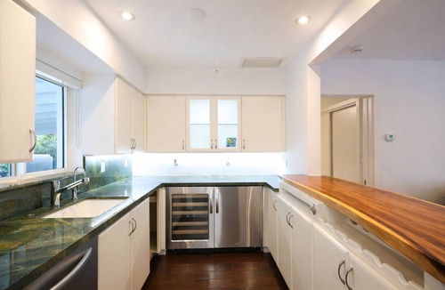 Dolphin Isles House | Luxury Intracoastal Home, Heated Pool, Walk to Beach, Yacht Views, Restaurants.