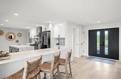 Shell Harbor House | Nestled along a pristine canal with long range views, this meticulously crafted residence defines coastal luxury at its finest.NEW!