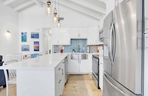 Rock Harbor House | Ocean Front Villa with endless Views, golf cart, paddle boards, kayak and bikes
