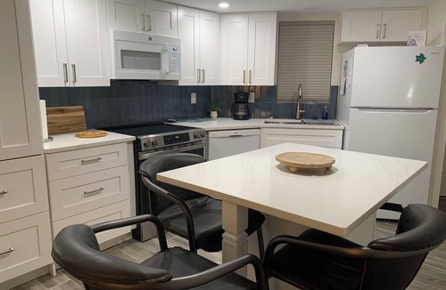 Mid Island Condo | ON THE BEACH AT THE SOFT WHITE SANDY SHORELINE