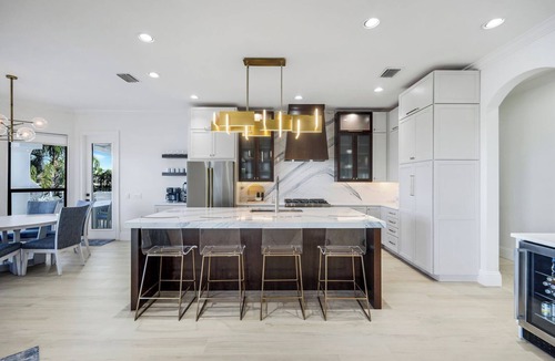Pelican House | Paradise Palms Retreat - 5 BR (Sleeps 13) All New - Pool, Dock, Theatre + Games
