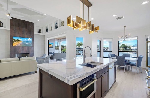 Pelican House | Paradise Palms Retreat - 5 BR (Sleeps 13) All New - Pool, Dock, Theatre + Games