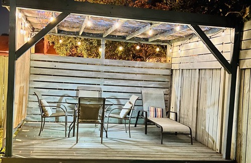 Gulfport House | Pet friendly cottage 1 block to beach fenced in yard with pergola & outdoor tub