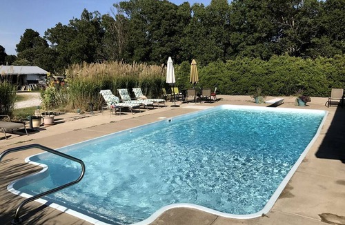 Crofton Cabin | Pet-Friendly Log Cabin with an Outdoor Pool near Crofton, Kentucky