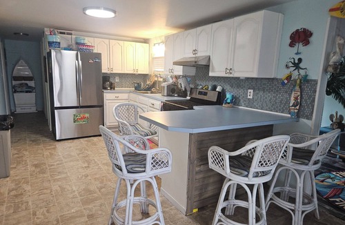 Mystic Island House | *Pet-Friendly Waterfront Tiki Escape with Fire Pit, bars, screened in porch