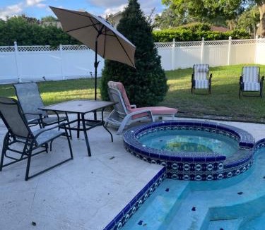Collins Estates House | PRIVATE HOT TUB, POOL BBQ fenced retreat, a mile walk from beaches pet Friendly