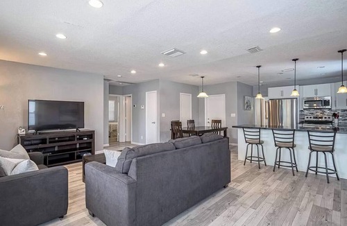 South Middle River House | Private pool club retreat- with a heated pool and spa that glow at night.