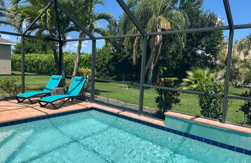 Pelican House | Private Tropical Oasis Heated Pool Outdoor Living Perfect Family Vacation