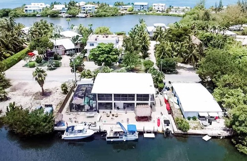 Pirates Cove House | Private waterfront resort, screened pool, hot tub, 90' dock, immaculate home.