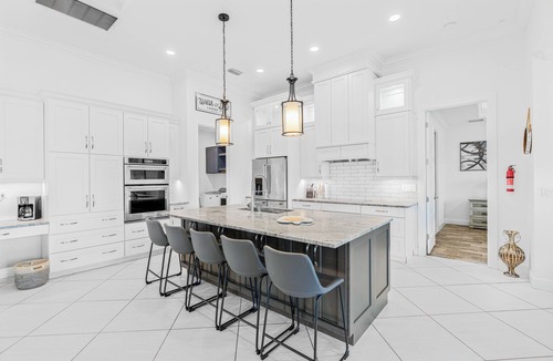 Trafalgar Villa | Relax at Coastal Vibes: Heated Saltwater Pool & Spa Game Room Waterfront View