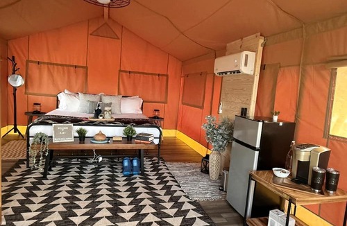 Braden River RV Rental | Relaxing Safari Tent with Fire Pit Near Anna Maria Island in Bradenton, Florida