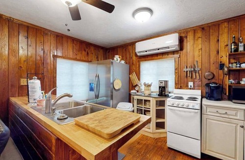Bonita Springs House | Riverfront dog-friendly cottages with kayaks, dock, patio, grill, & water views