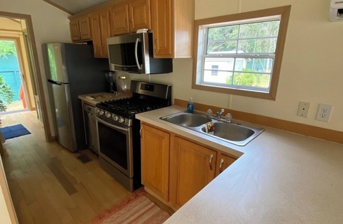 Milton RV Rental | ROOMY PARK MODEL HOME WITH PRIVATE BEDROOM WITH QUEEN SIZE BED, FULL KITCHEN AND BATHROOM, LIVING ROOM WITH PULL-OUT QUEEN-SIZE BED IN COUCH. HAS COVERED PARKING & A DECK, WITH SHED. MONTHLY RATE IS $1,400, BUT PLEASE CALL FOR AVAILABILITY.