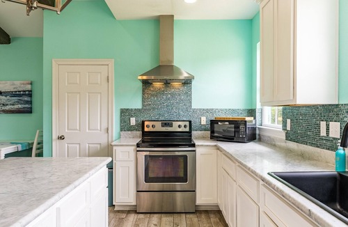 Ocean Springs House | Sassy Seas 2BR Cottage near Ocean Springs: Gulf Views, w/Balcony & Fire Pit