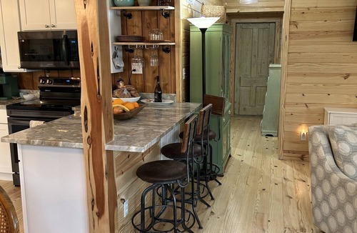 Fairhope Cabin | Secluded waterfront fishing cabin, boat dock, pier, sunsets, boat to beach