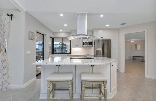 Punta Gorda House | SENSATIONAL! WATER-VIEW, LUXURY REMODEL, SUNNY HEATED POOL, HUGE 145’ SEA WALL