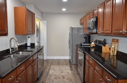Mary Esther House | Sleeps 8! Pet friendly retreat by the beach + movie room and large fenced yard