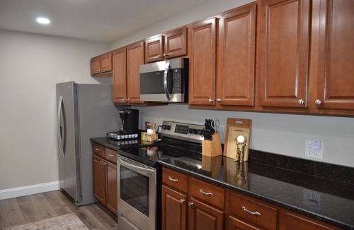 Mary Esther House | Sleeps 8! Pet friendly retreat by the beach + movie room and large fenced yard