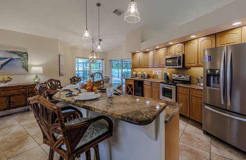 Caloosahatchee Villa | Sleeps up to 10 - game room - pool with hot tub - Stars Vacation Rentals